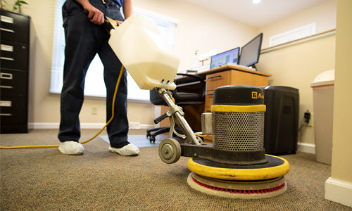 Cleaning carpet in commercial office