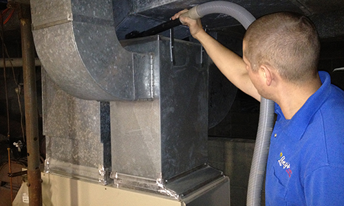 Cleaning out residential air duct in basement
