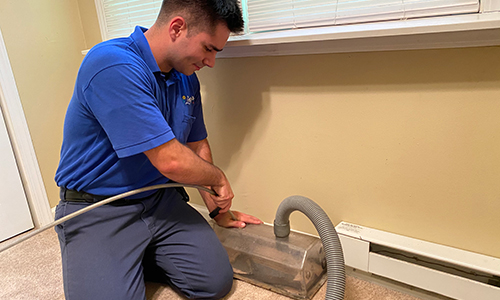 Cleaning out residential air duct in living room