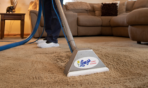 Vacuuming carpet in a residential home