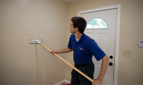 Wall cleaning using wand in a residential home
